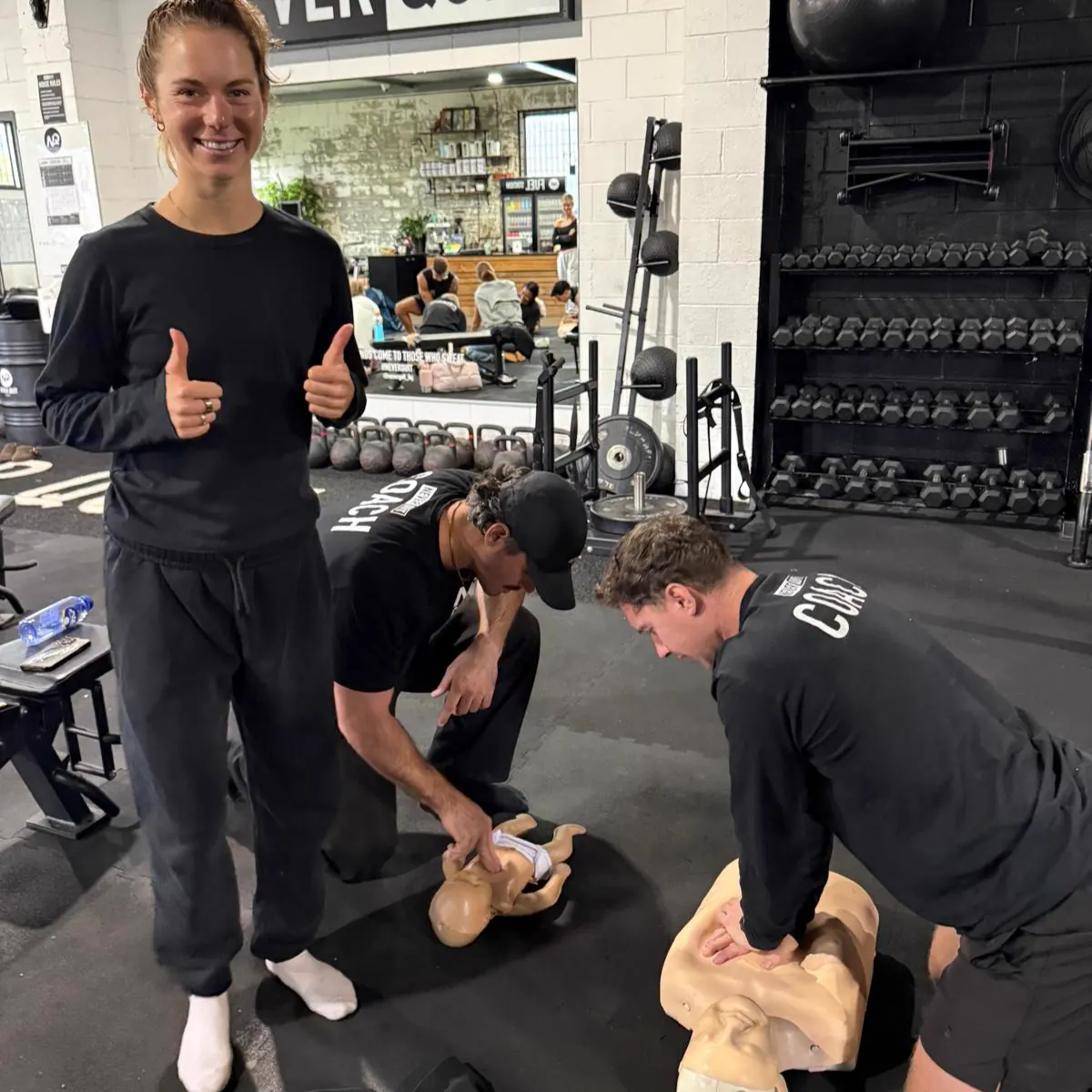Hands-on first aid course practice with CPR and emergency response equipment