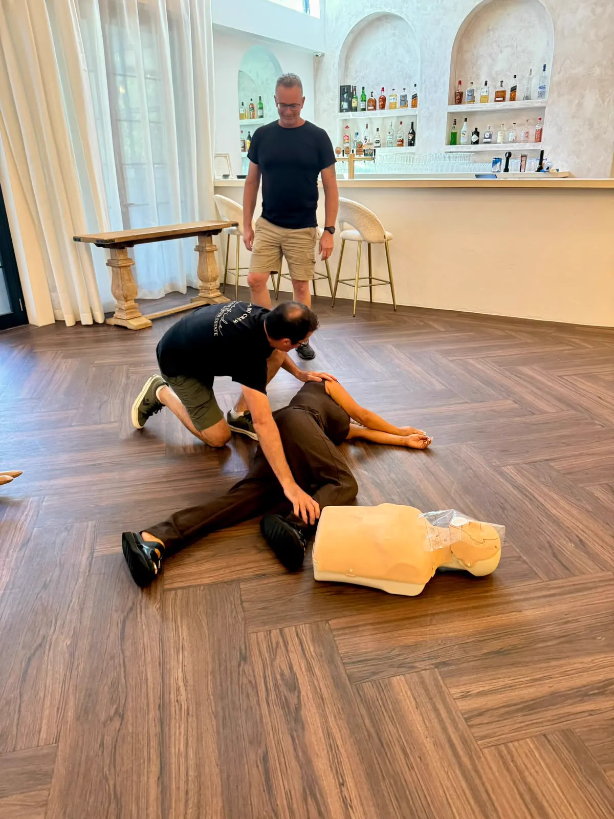 Hospitality venue first aid training with recovery position practice
