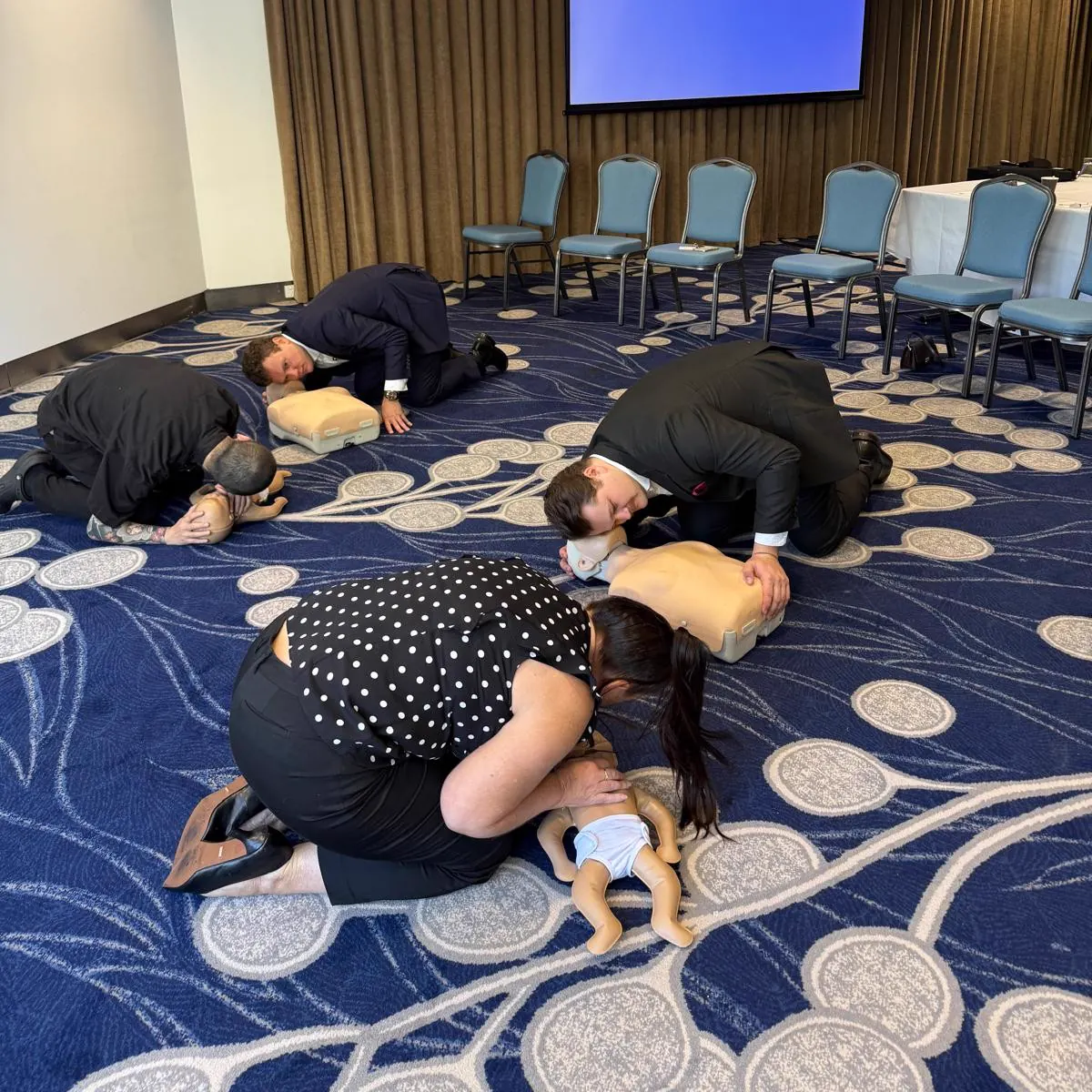SKLD Training onsite CPR course with adult and infant manikins on the Gold Coast