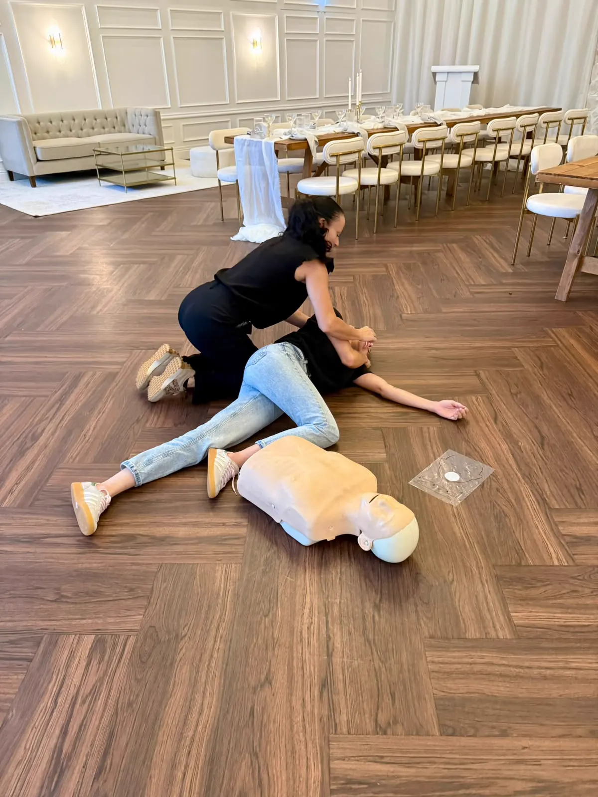 Recovery position practice during onsite first aid training at a venue